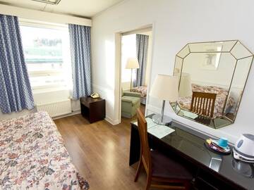Фото номера Семейный номер Отель Kauppahotelli Grand г. Лахти 6